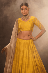 Radiant yellow silk lehenga and blouse with georgette dupatta
