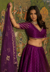 Bright purple lehenga, blouse and organza dupatta