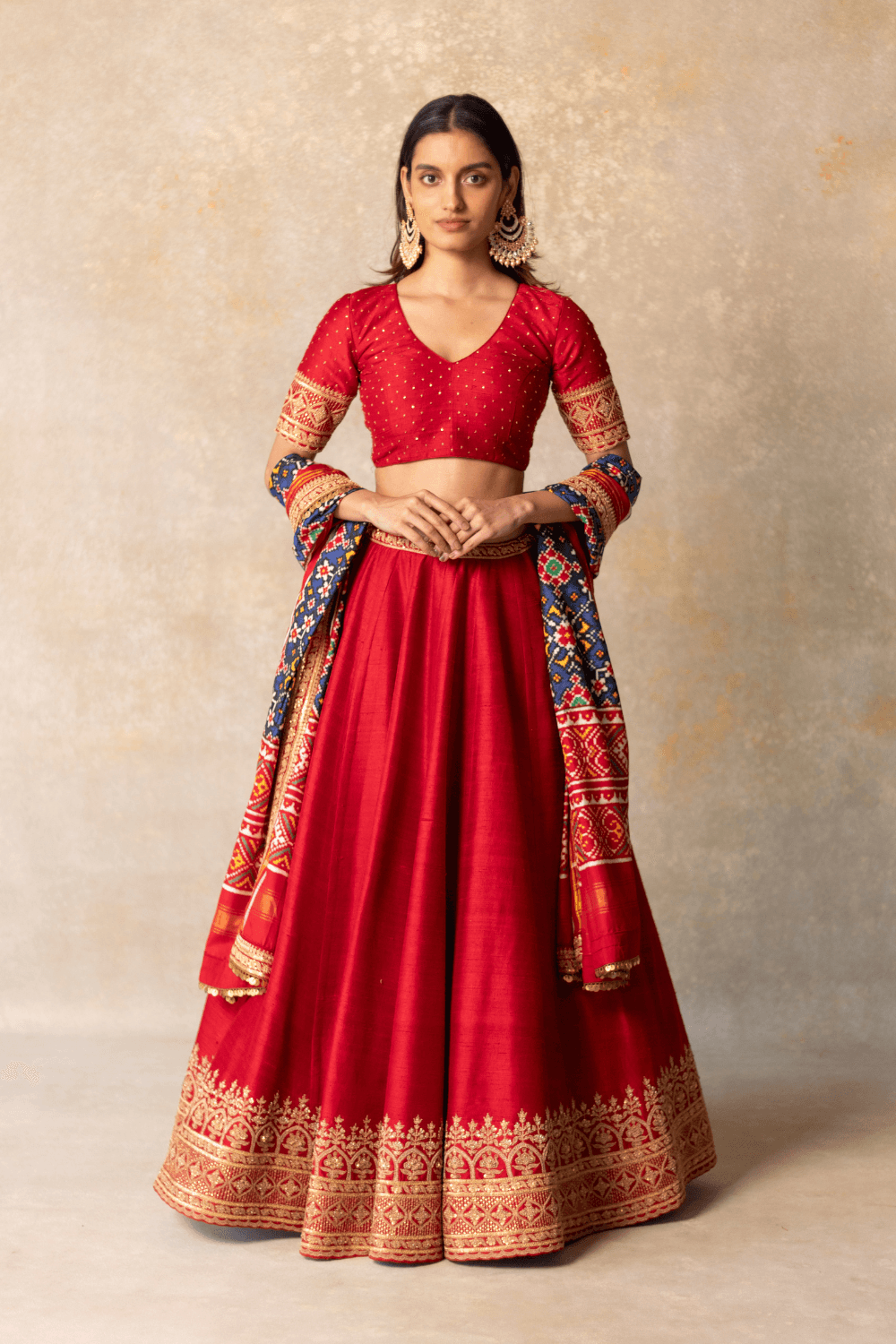 Red silk lehenga with patola dupatta