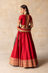 Red silk lehenga with patola dupatta