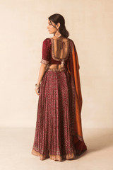 Maroon Ajrakh bandhej lehenga with orange dupatta