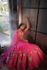 Graceful pink silk lehenga & blouse with  net dupatta